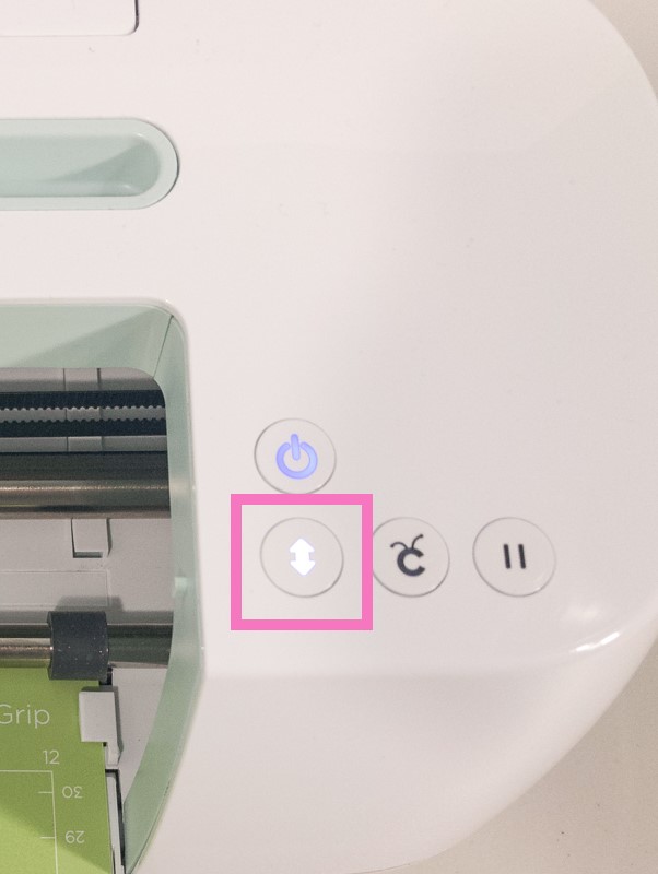 Press the blinking load button on your Cricut to load your Cricut mat