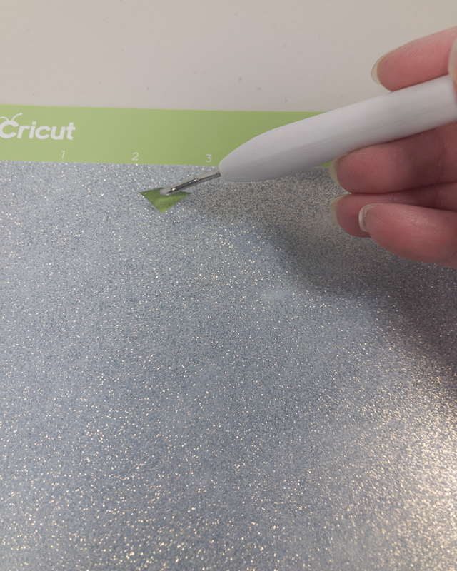 Insert your weeding tool into the valley of the heart to begin weeding your design