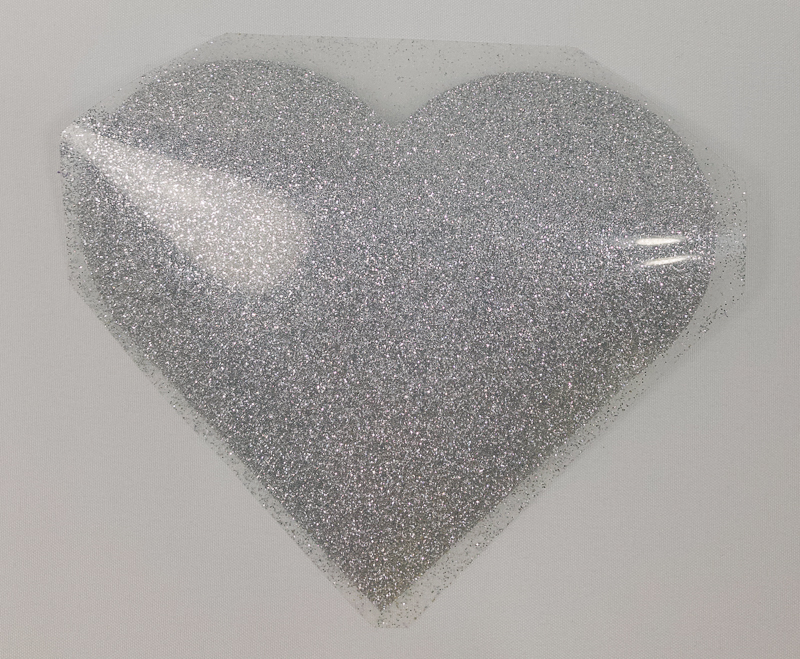 Glitter iron on heart after it has been weeded