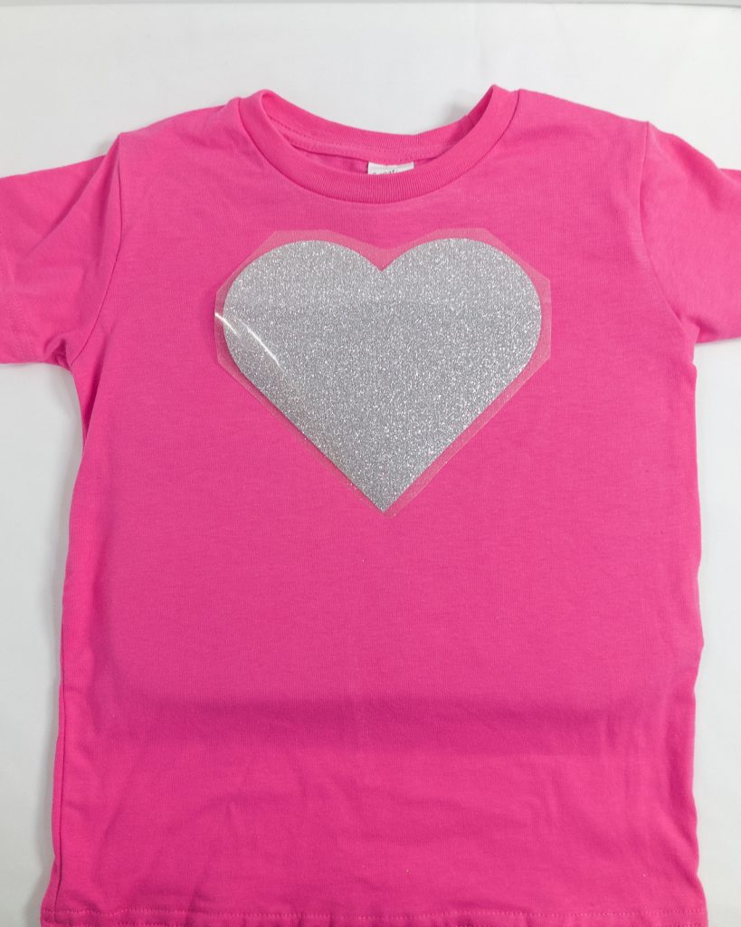 Place your glitter heat transfer vinyl design where you would like it on your t-shirt