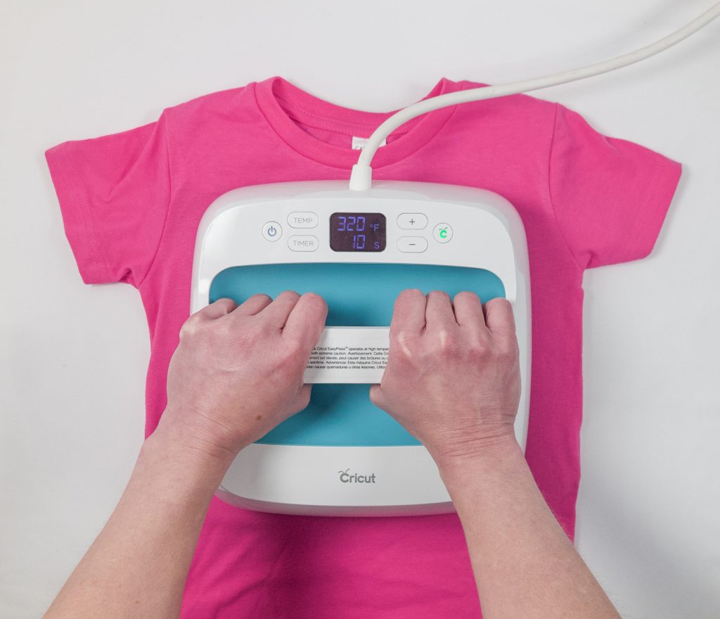 Use a Cricut EasyPress to adhere your design to your t-shirt